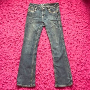 LA IDOL FLARED LOW RISE JEANS